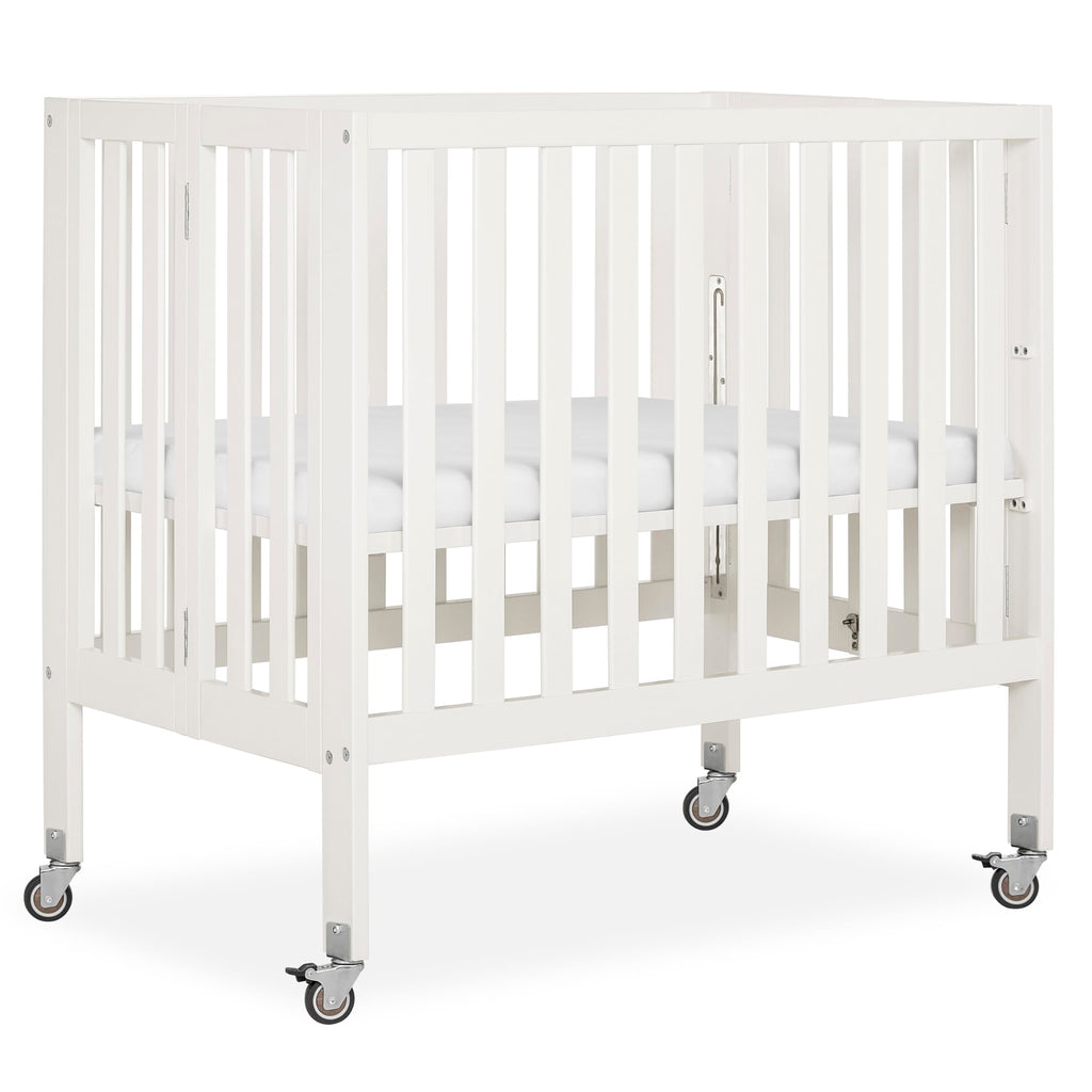 Dream On Me Jett Mini Folding Baby Crib in Pebble Grey, GreenGuard Gold & BSA, Lightweight & Portable, Patented Flat Folding System, Small Spaces & Travel, 1.5” Mattress Pad, 3 Heights, Safe Wheels
